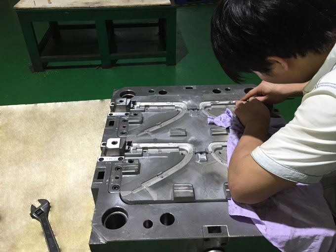 Injection mold maker